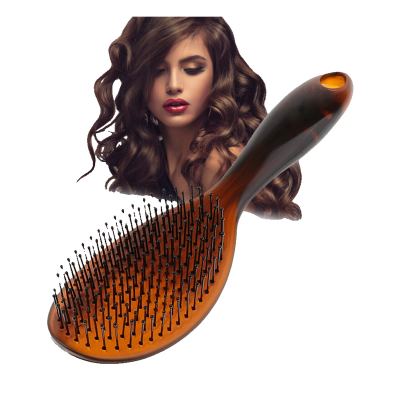 فرشاة شعر بيضاوية كبيرة مع شعيرات من الراتنج المبطنة لتنعيم وتمليس وفك تشابك الشعر وتصفيفه لوصلات الشعر الطبيعي.
