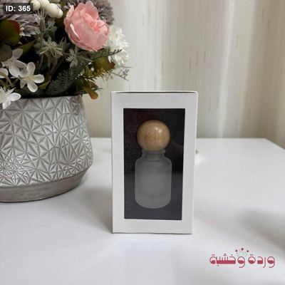 علبة عطر بشكل مميز في علبة كرتون سحب