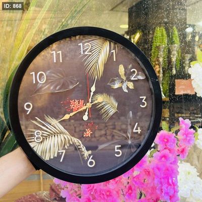 ساعة حائط اطار اسود رسمة ورقة 35سم